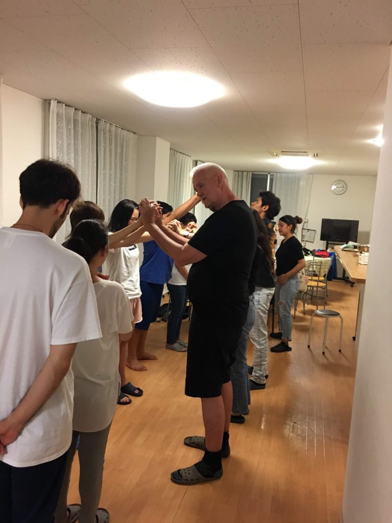 Paul praying for youth in Tokyo